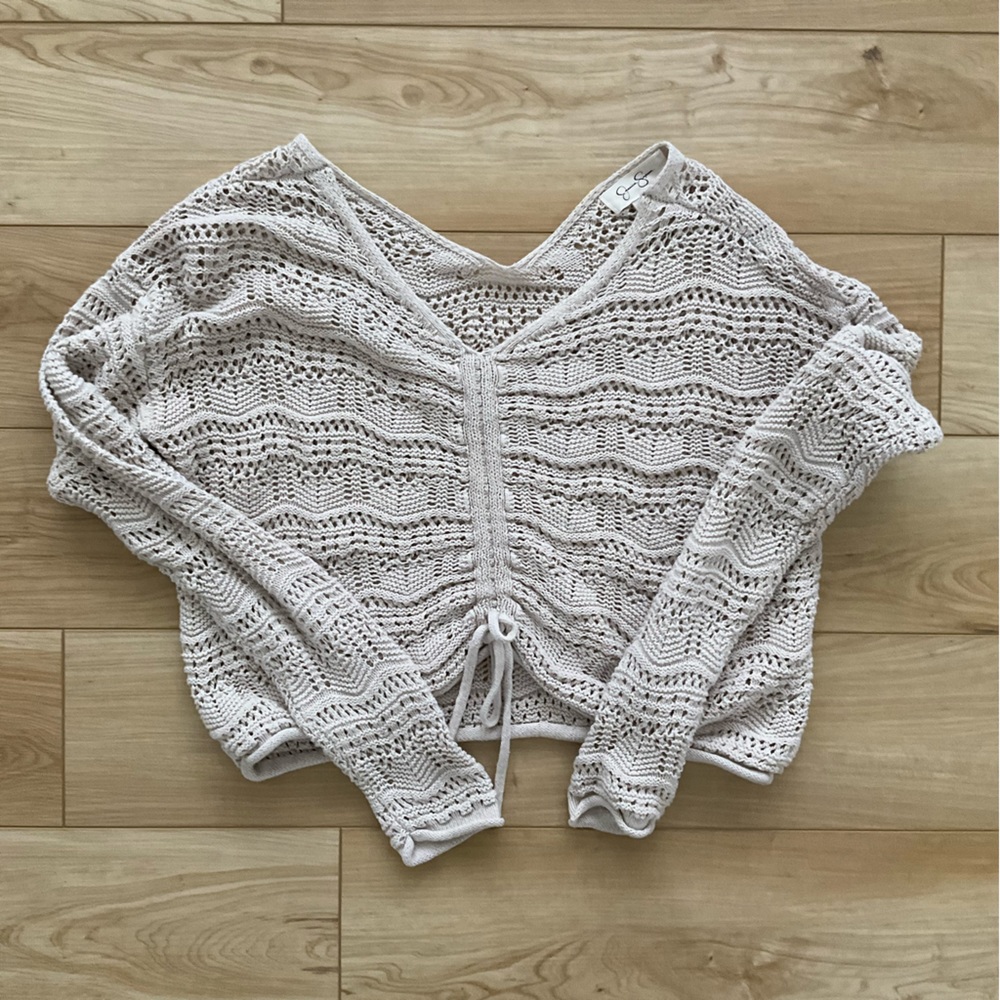 Jessica Simpson cropped open knit sweater with adjustable front ruched detail.